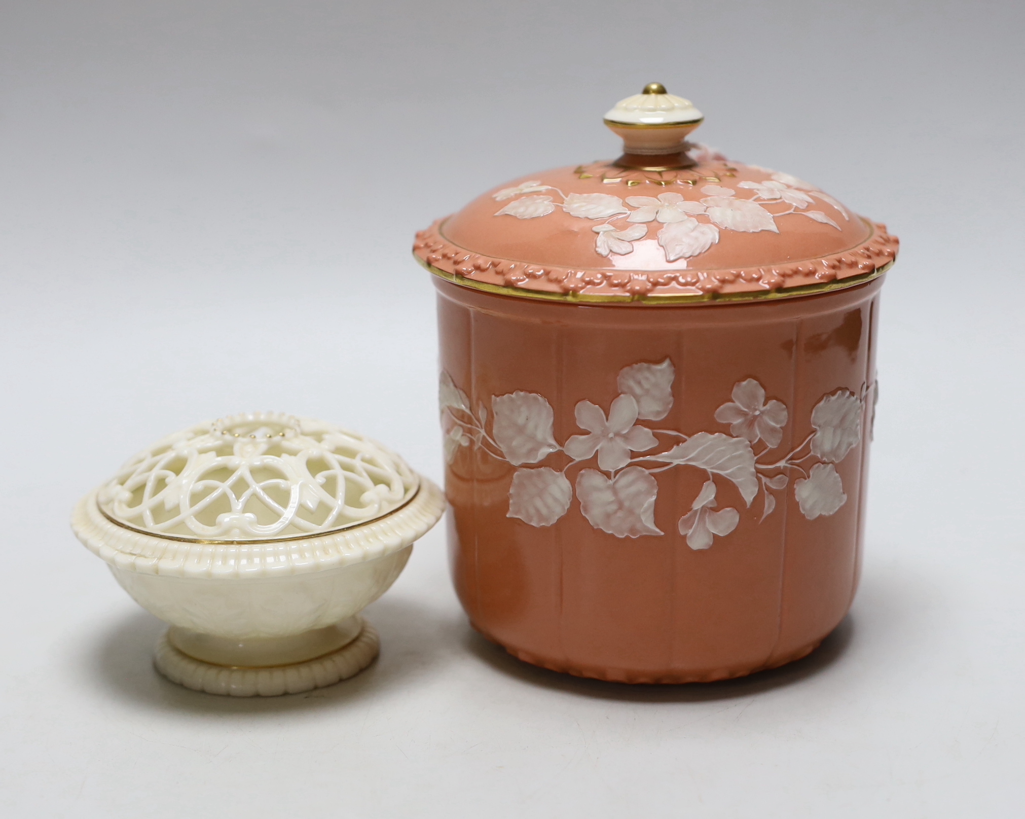 A Grainger’s or Locke Worcester pate-sur-pate jar and cover, the salmon ground decorated with white flowers and a Grainger’s white glaze and gilt pot pourri both c.1880, the largest 15cm high